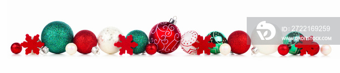 Long Christmas border of red, white and green ornaments isolated on a white background