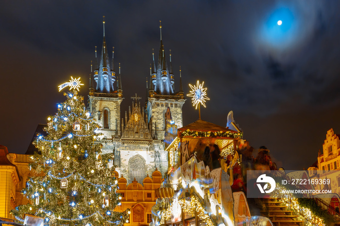 Old Town Square with Christmas tree and fairy tale Church of our Lady Tyn in the magical city of Pra