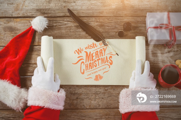 Composite image of close-up of santa claus opening scroll