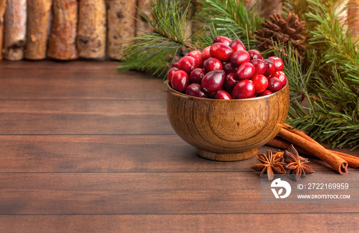 Bowl of Fresh Round Red Cranberries on a Wooden Table