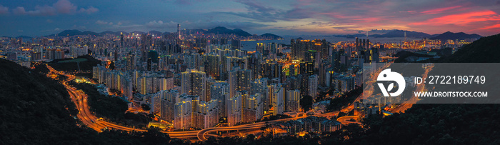 Panorama aerial view of Hong Kong City at sunset.