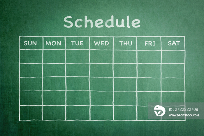 Schedule with grid timetable on green chalkboard