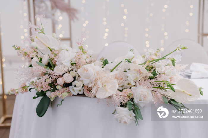 festive tables decorated with compositions of flowers and greenery