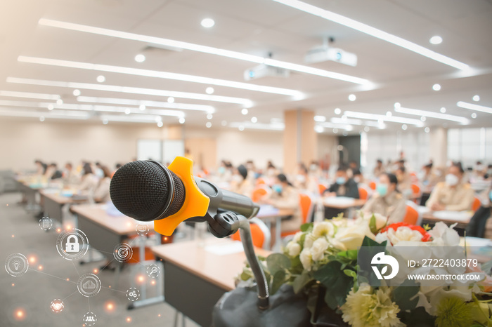 Soft focus of head microphone on stage, blurred people background, Thai government officers Meeting Forum Conference Training Learning Seminar. Knowledge development to work successfully to the goal.