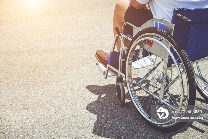 Disabled people sitting on the wheelchair in the park