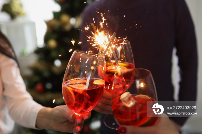 People doing clink with glasses filled with champagne beverage