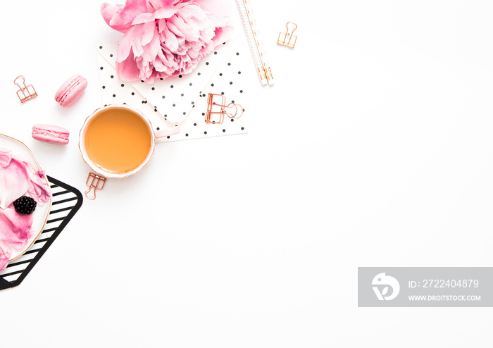 Feminine desk scene - flatlay with peony and pink items