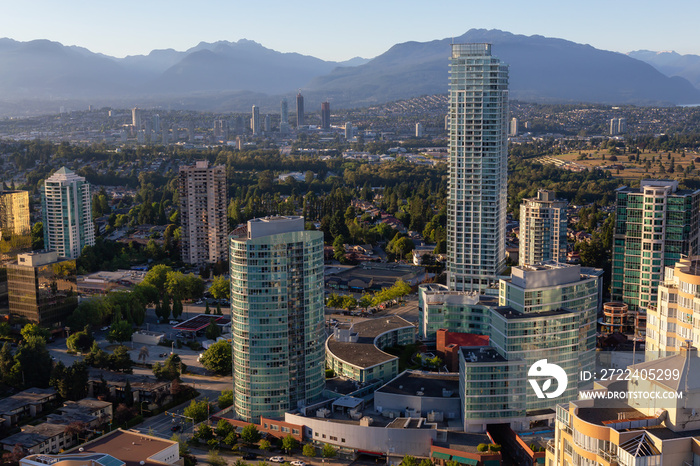 Aerial view of a modern city during a vibrant sunset. Taken in Metrotown, Burnaby, Vancouver, BC, Canada.