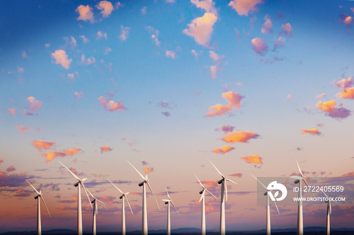 Renewable energy and wind turbines. Wind mills farm and sunset landscape.