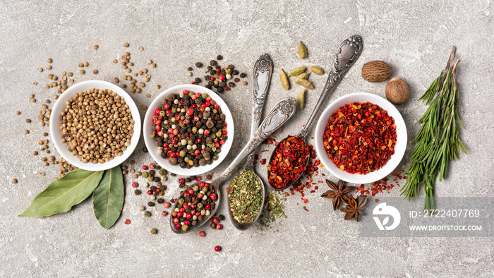 Different spices, dry kitchen herbs and seeds for tasty meals