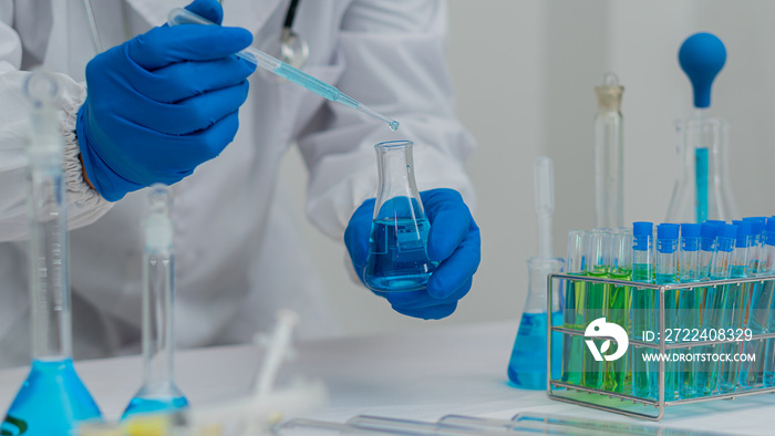 Laboratory scientists work with in vitro liquid test tubes for healthcare researchers, and medical science technology, to test vaccines. hospitalization