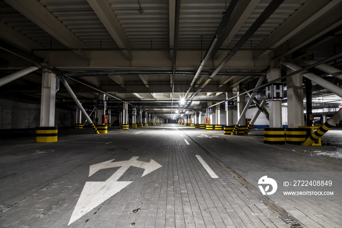 Underground illuminated parking with no people and stripped elements