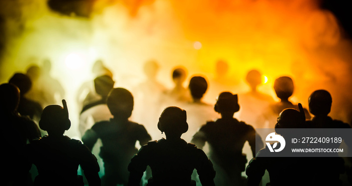 Anti-riot police give signal to be ready. Government power concept. Police in action. Smoke on a dark background with lights. Blue red flashing sirens.