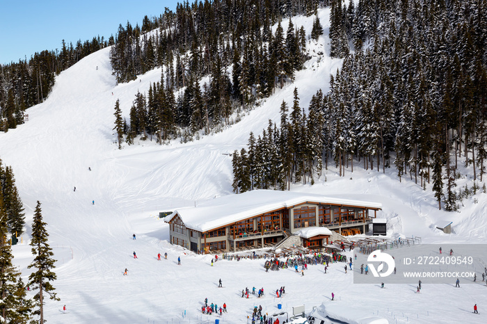 Aerial View of a big Cabin on a Ski Resort during a vibrant winter day. Taken on Blackcomb Mountain, Whistler, British Columbia, Canada.