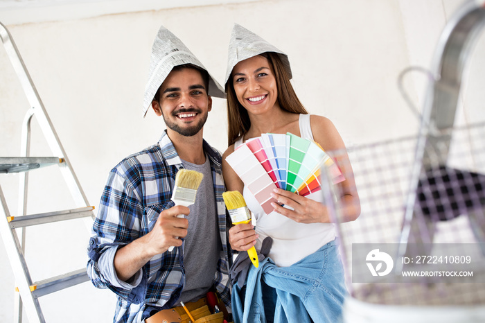 We are ready for painting, young couple choosing colors for new home