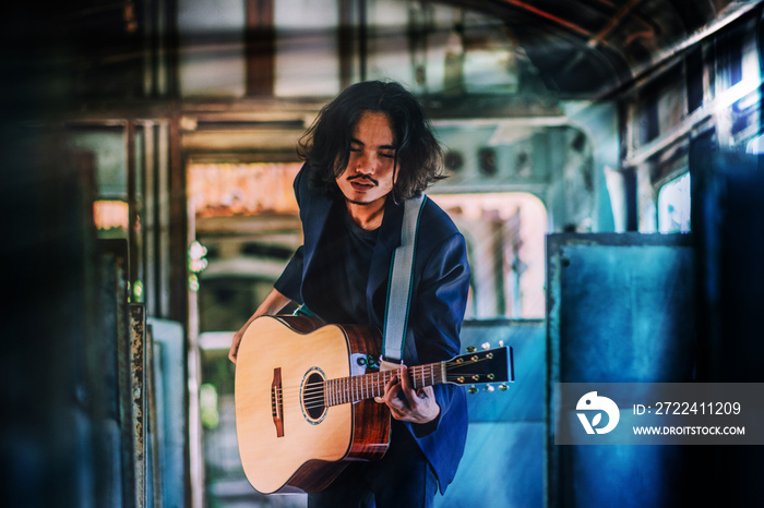 Man playing guitar rock so excited music entertainment , man play guitar on train