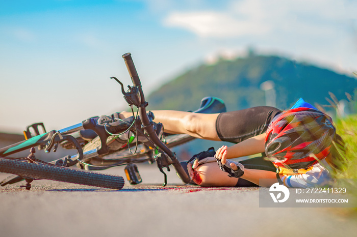 accident clashed on young woman bicyclist in hurt and injured of leg after accident clashed, with wound and bleeding of blood flow on the surface of street road