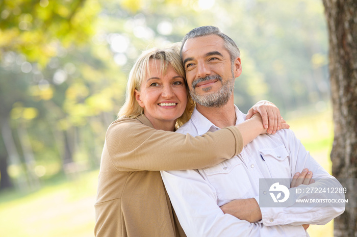 Health care happy senior lifestyle concept : Portrait photo of old happy senior caucasian couple smiling and relaxing in outdoor park on sunny day, hoot senior couple relax in spring or summer time.