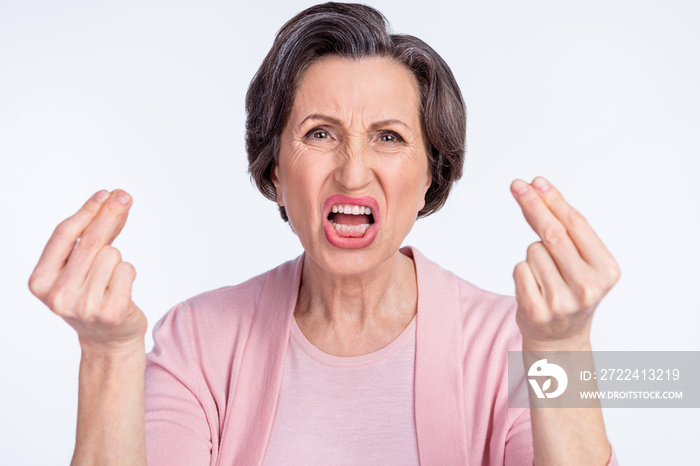 Photo of furious angry age woman dressed pink outfit shouting rising fingers isolated white color background