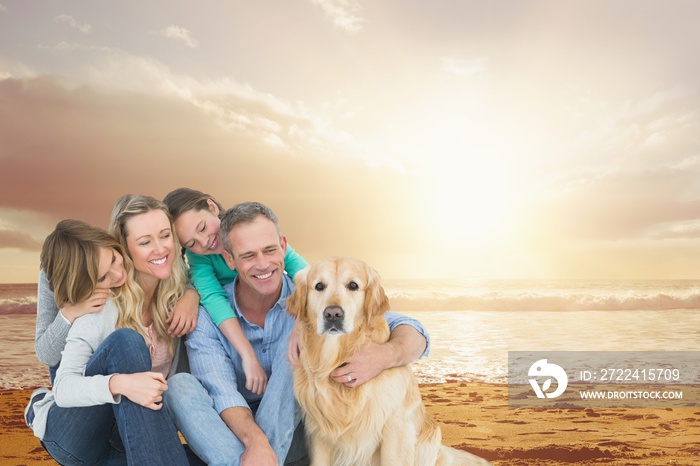 Smiling family with a dog on the beach