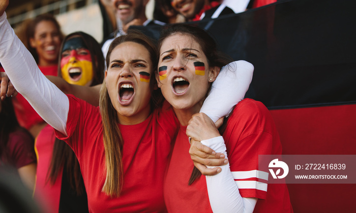 Females from Germany cheering from fan zone