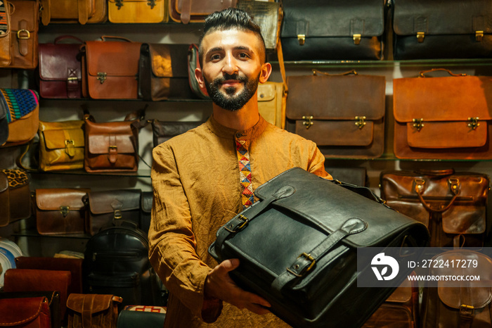 egypt sallerman showing his bags at arambol goa market