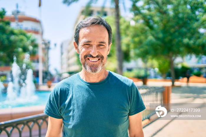 Middle age man with beard smiling happy outdoors