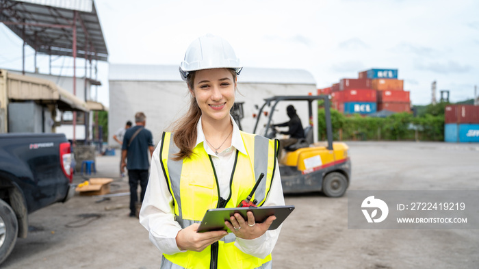 Woman foreman control forklift carry Big Wheel of Containers cargo forklift at Maintenance Shop in warehouse , Manager Woman in white helmet Safety Supervisor in Container Custom Terminal port