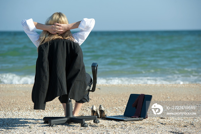 Business woman on the beach