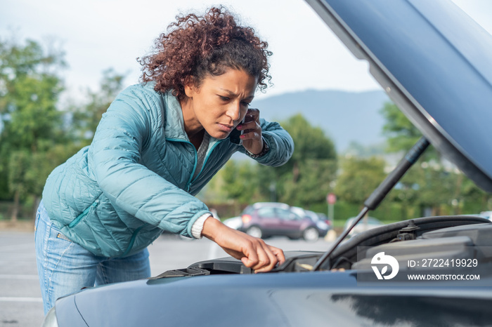 Calling roadside service after car engine breakdown