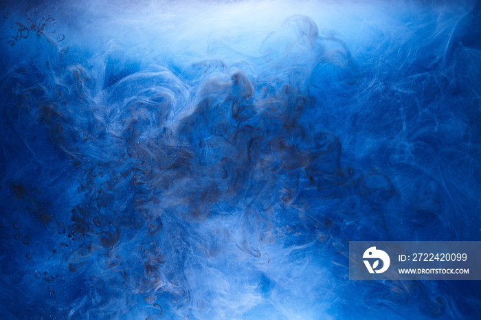 Blue smoke on black ink background, colorful fog, abstract swirling ocean sea, acrylic paint pigment underwater