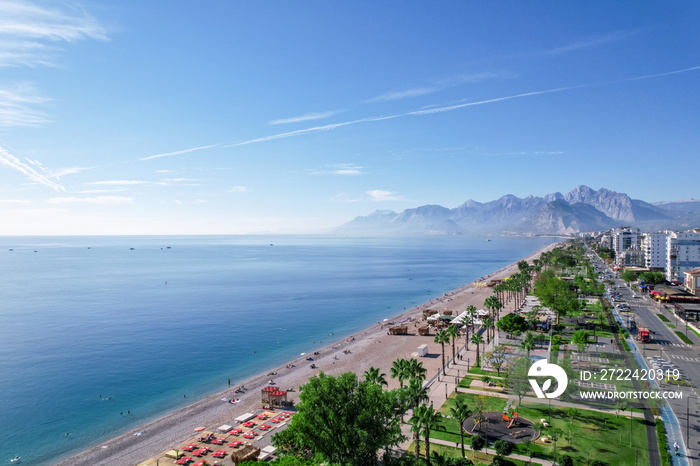 Aerial view of beautiful blue gulf and Konyaalti beach in popular resort city Antalya, Turkey.