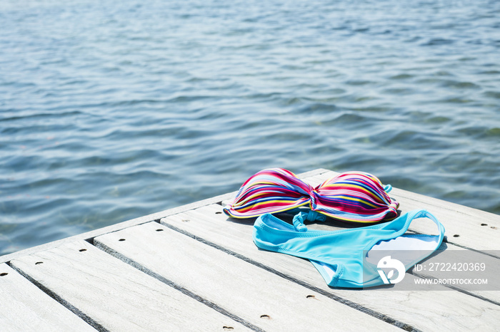 bikini drying on a wooden pier