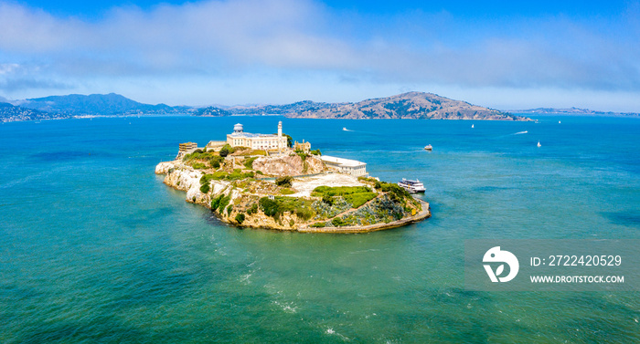 Beautiful aerial view of the Alcatraz island with Golden Gate bridge on the background in San Francisco, USA.