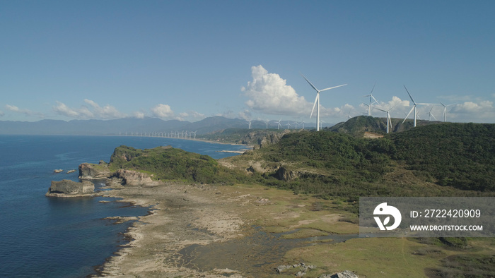 Aerial view of Windmills for electric power production on the coast. Bangui Windmills in Ilocos Norte, Philippines. Ecological landscape: Windmills, sea, mountains. Pagudpud