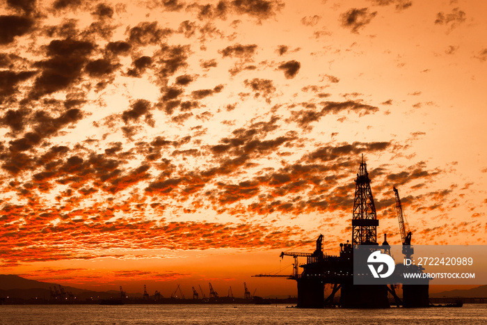 Silhouette of Oil Drilling Rig in Guanabara Bay in Rio de Janeiro, Brazil With Dramatic Sunset Sky