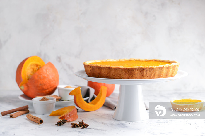 Tasty pumpkin pie on table