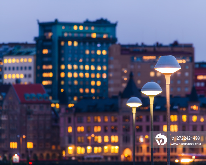 Street lamp in front of cityscape