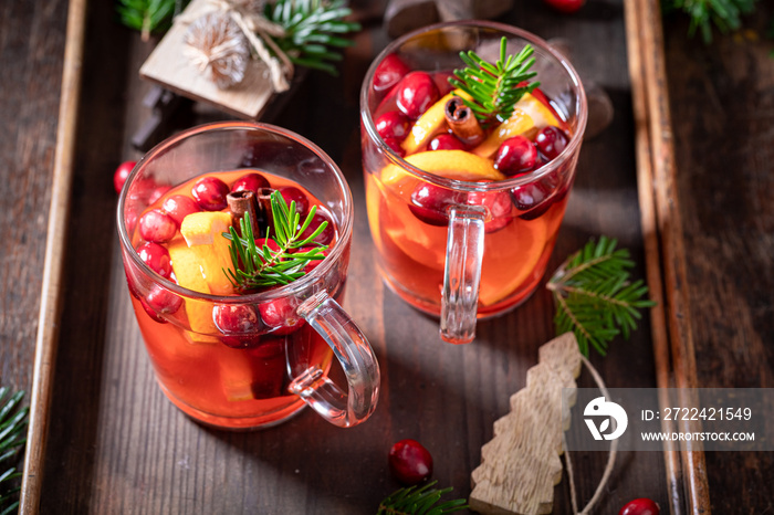 Hot Christmas punch with orange, cranberry and cinnamon,