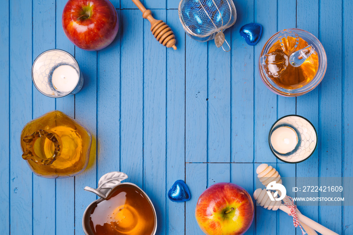 Wooden background with honey and apple for Jewish holiday Rosh Hashana. View from above. Flat lay