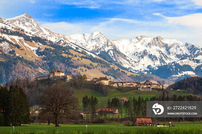 Medieval Town of Gruyeres and Castle with mountains in the background, Canton of Fribourg, Switzerland