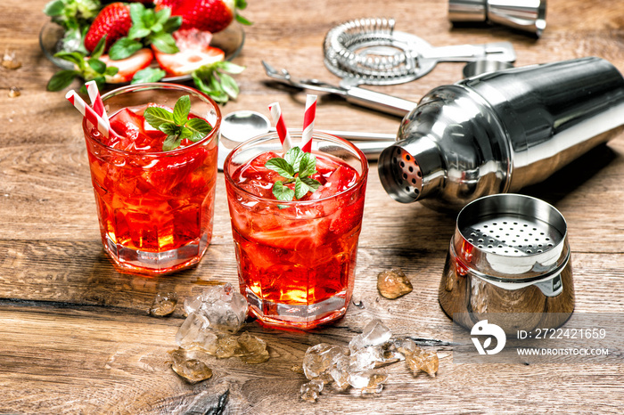 Cocktail making bar tools Red drink with ice