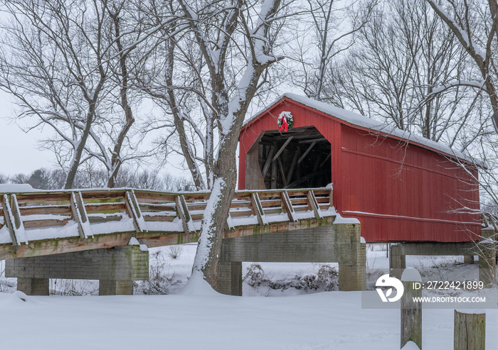 Beautiful Red Snowy Covered Bridge At Christmastime in Central Illinois.
