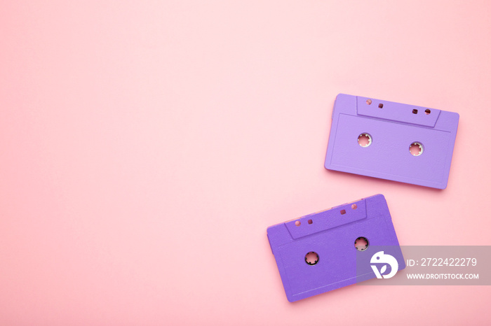 Two old colorful cassettes on a pink background. Music day