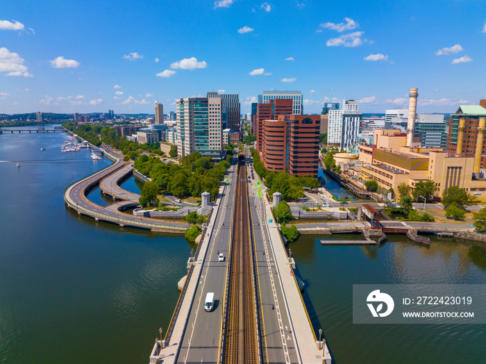 Cambridge Kendall Square skyline and Longfellow Bridge aerial view, Boston, Massachusetts MA, USA. The bridge connects Cambridge and Boston over Charles River is a steel rib arch bridge built in 1906.