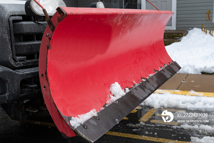 Snowplow clearing the street in a city driving