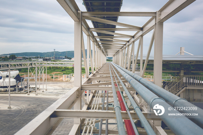 Steel long pipes rack work at high factory during refinery Petrochemistry industry chemical