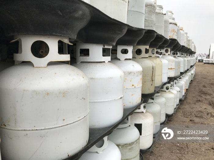 Rows of empty propane tanks waiting to be reused