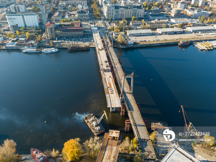 Bridge construction site in Kiev. Sunny autumn morning. Aerial drone view.