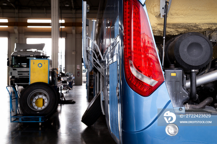 bus and truck waiting for service and maintenance in the garage. automobile and transportation concept.